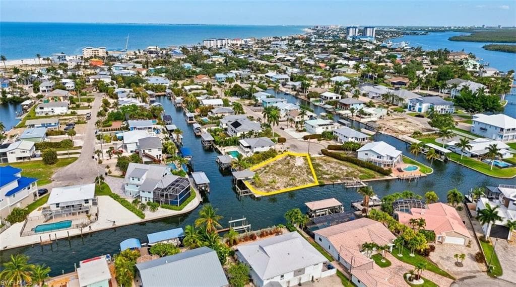 Waterfront lot featuring direct canal access, a clear building site, and proximity to the Gulf of Mexico - Virtually Edited Image