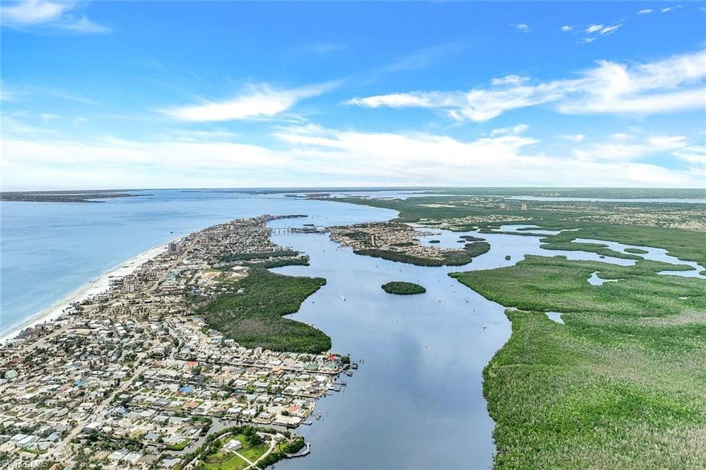 Coastal area featuring a barrier island, expansive waterways, and abundant natural foliage - Virtually Edited Image