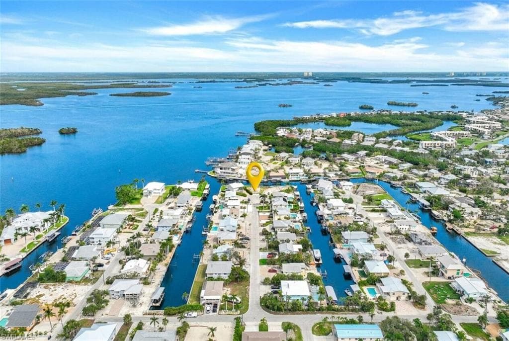 Coastal canal-front property featuring direct water access - Virtually Edited Image
