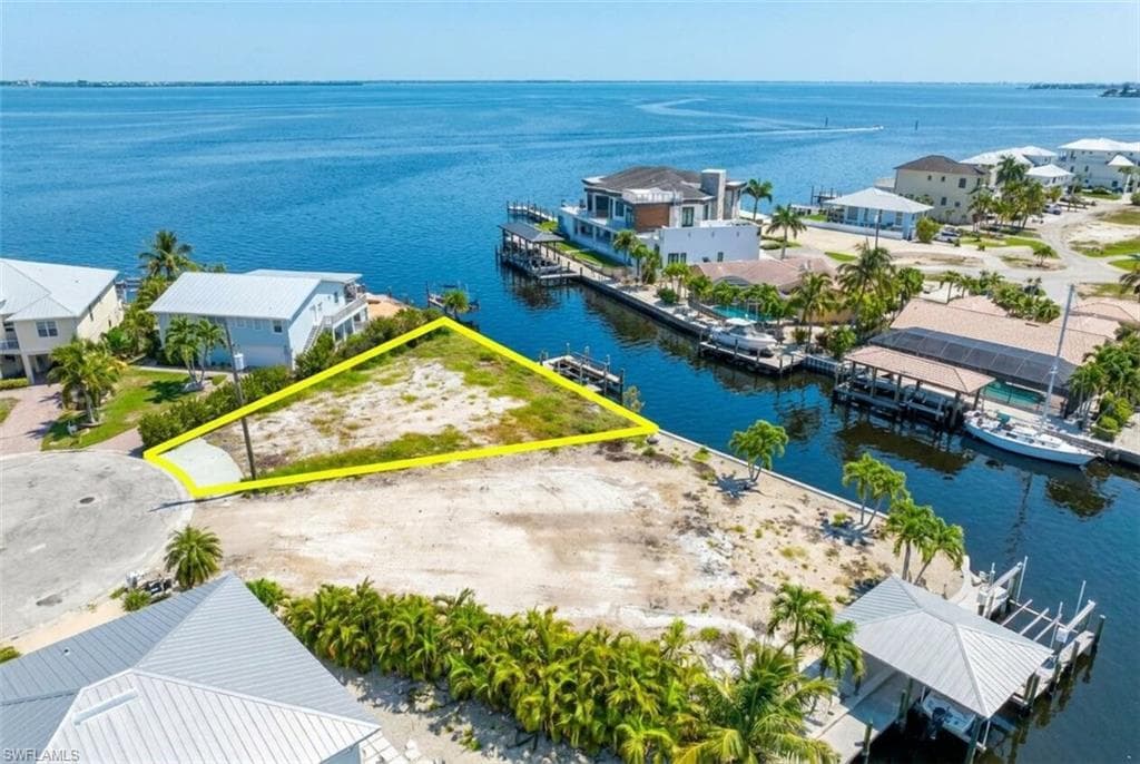 Waterfront lot featuring direct canal access to open water - Virtually Edited Image