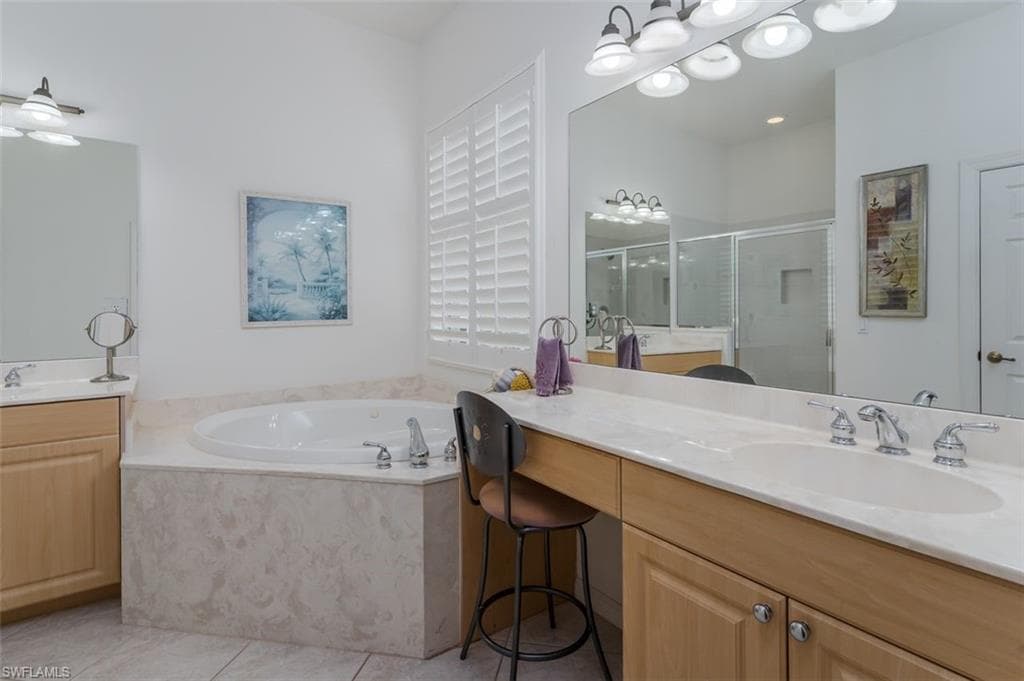 Primary Bath has jetted tub.