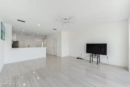 Living Room with ceiling fan, recessed lighting, and light wood-style floors