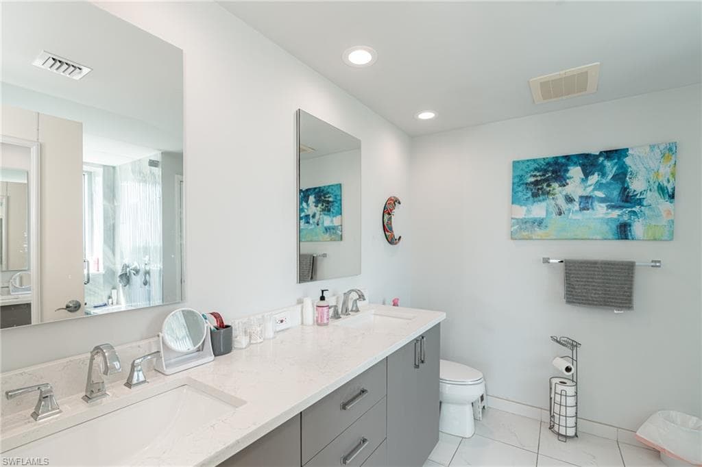 master bathroom with custom shower, extra storage and double sinks