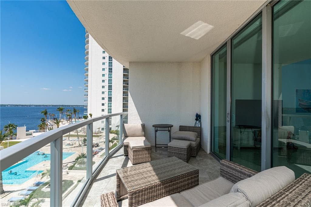 private balcony from the living room, overlooking pool and the river
