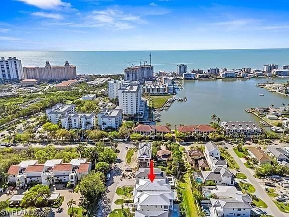Coastal community featuring a prominent body of water, extensive shoreline, and a variety of architectural styles