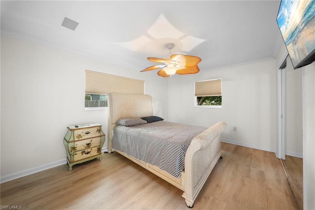 Light wood-finish flooring complements the crisp white walls
