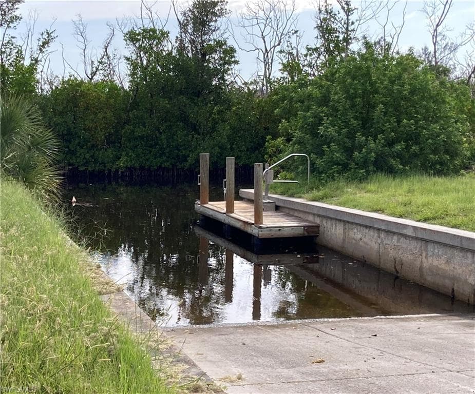 Dock featuring a boat ramp and a water view