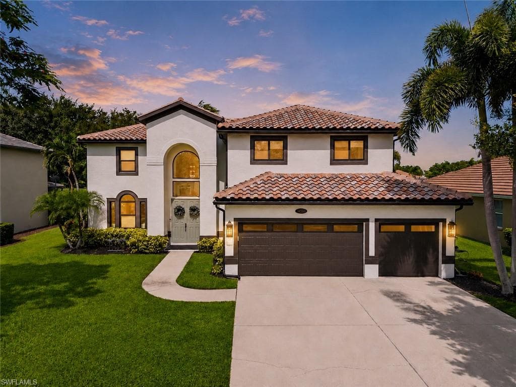 Two story residence a new tile roof, stucco exterior, and a two-car garage