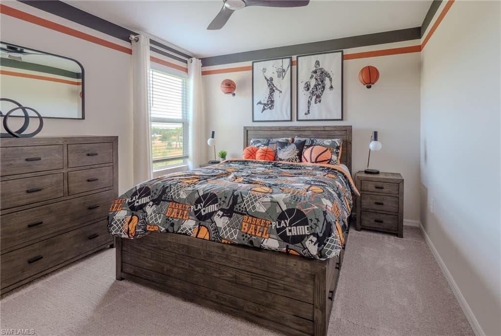 Bedroom featuring neutral carpeting, a window with blinds, and a ceiling fan