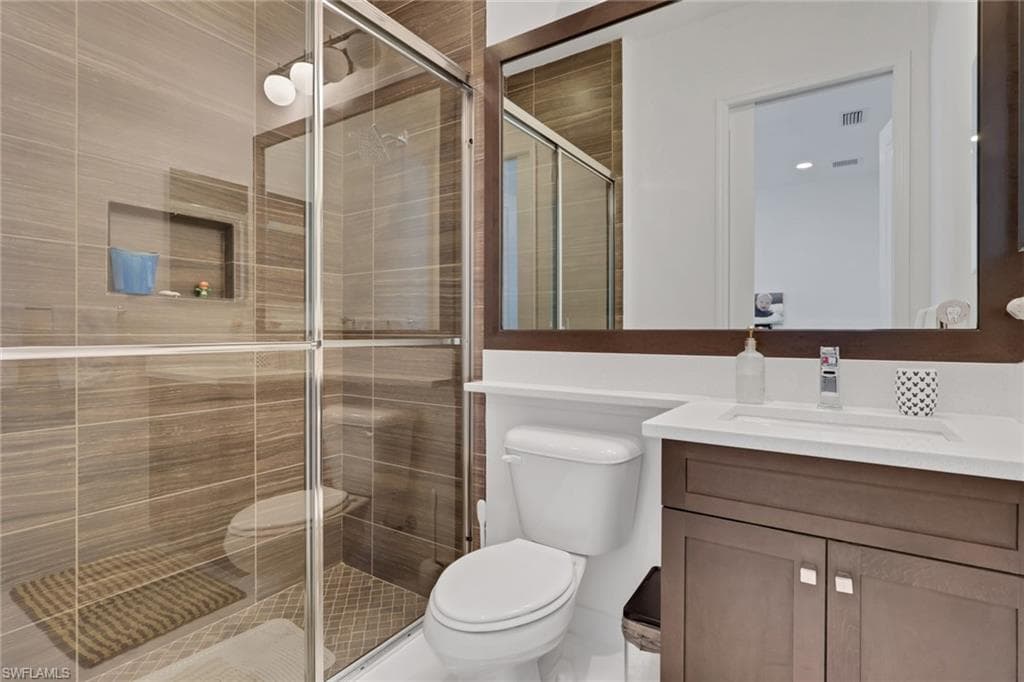 Beautifully updated full bathroom attached to one of the bedrooms on the first floor