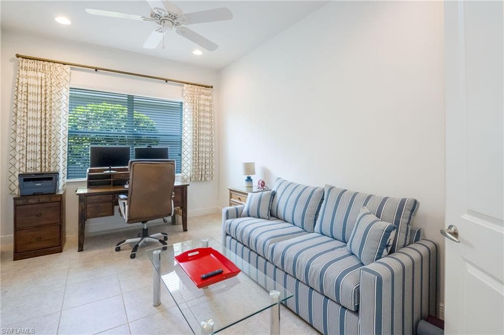 Room featuring light-toned tile flooring and white walls