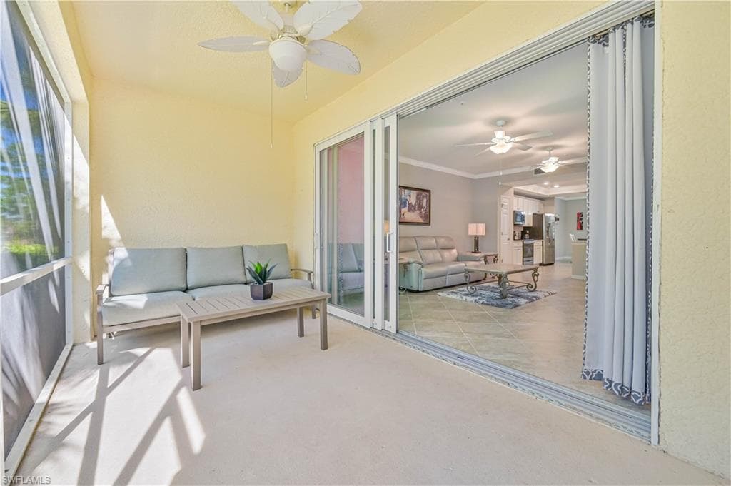 Private screened lanai offering seamless indoor-outdoor living and peaceful views of the lush preserve, creating the perfect setting for morning coffee or evening relaxation.