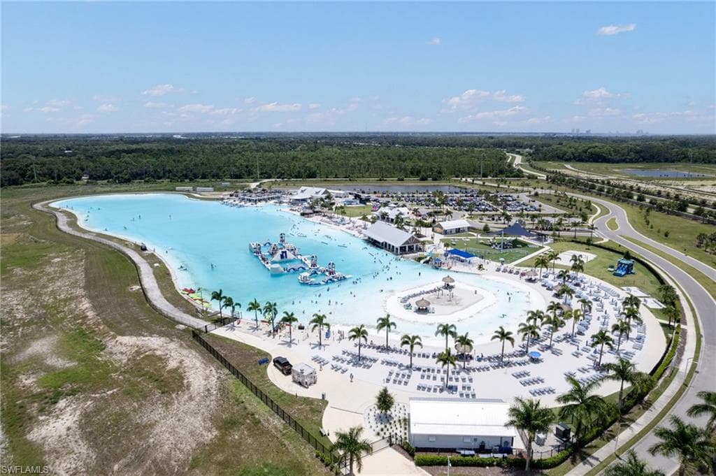 Expansive lagoon with clear blue water and floating obstacles