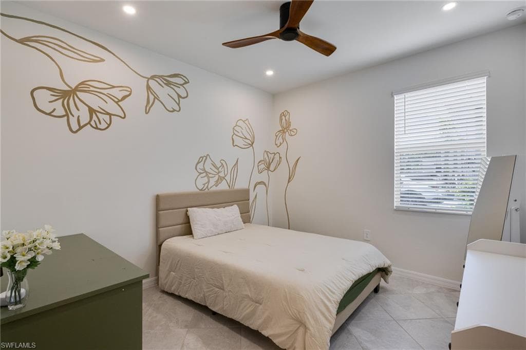 Bedroom featuring light-toned tile flooring, recessed lighting, and a ceiling fan