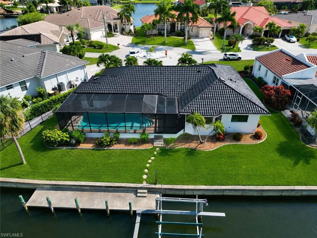 Stunning aerial view showcasing the homes layout and water front