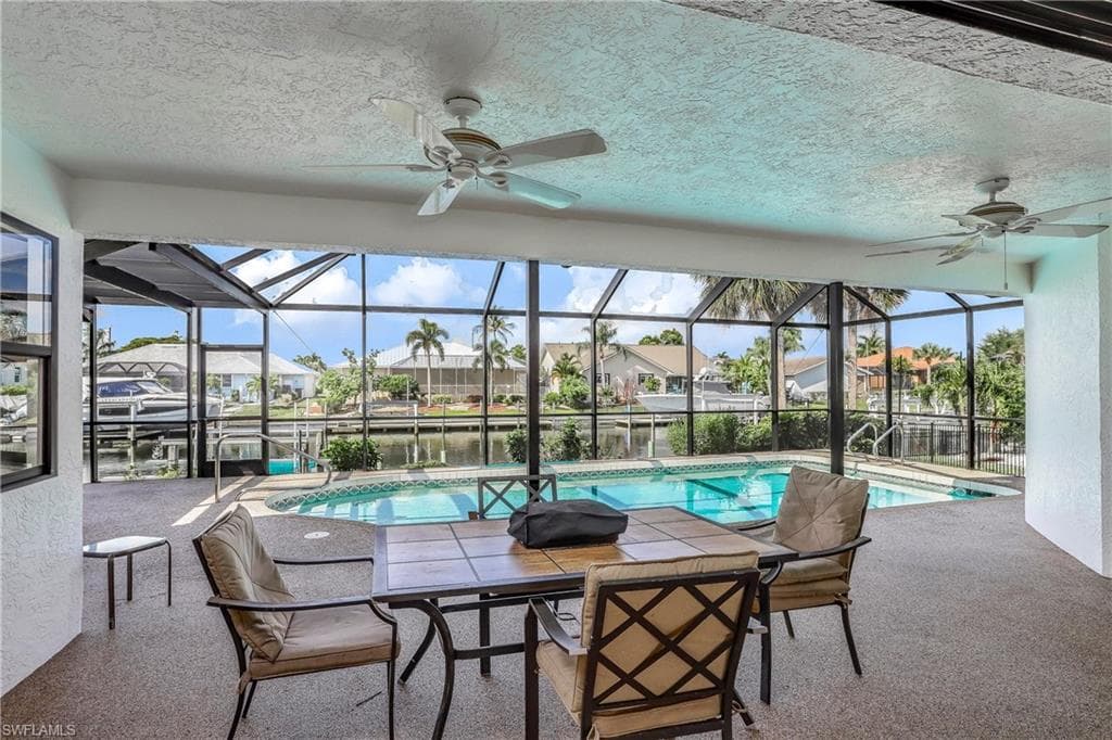 Covered lanai area with outdoor seating