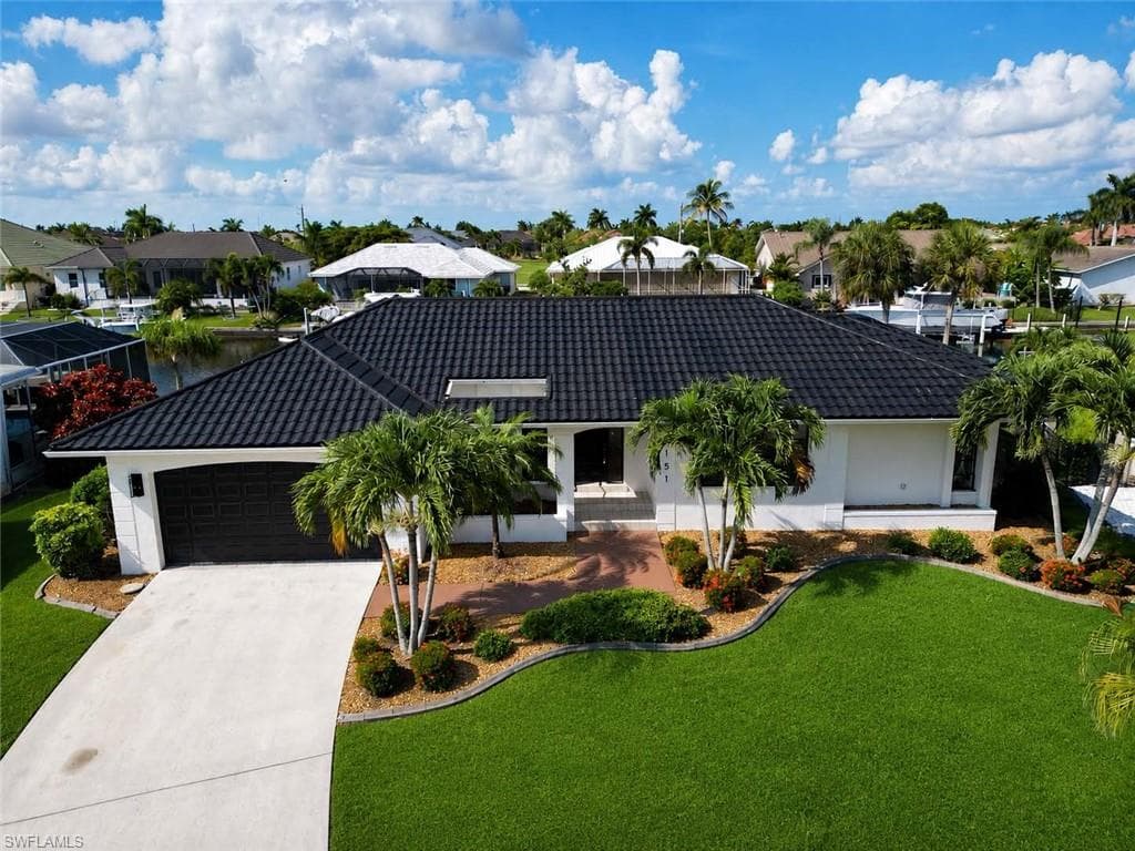 Beautiful curb appeal with manicured landscaping