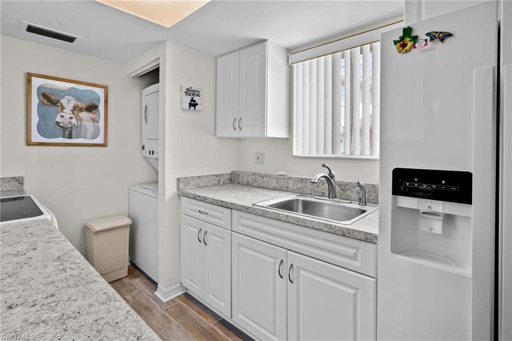Kitchen. Nice window over the sink for lots of natural light. Updated cabinetry and countertops. Range/oven, washer/dryer, refrigerator with water/ice on the door. All kitchen items are included.