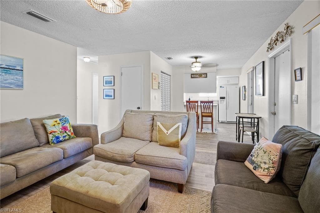 Fully Turn-key (everything included). Gorgeous upgraded, tile flooring.Just bring your bags and head for the pool. Large front windows for lots of natural light. Front door and large window, breakfast bar. All appliances included.