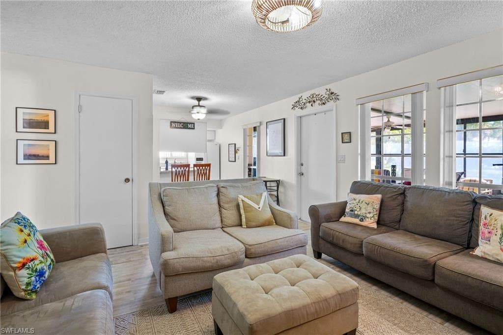 Fully Turn-key (everything included). Gorgeous upgraded, tile flooring.Just bring your bags and head for the pool. Large front windows for lots of natural light. Front door and large window, breakfast bar.