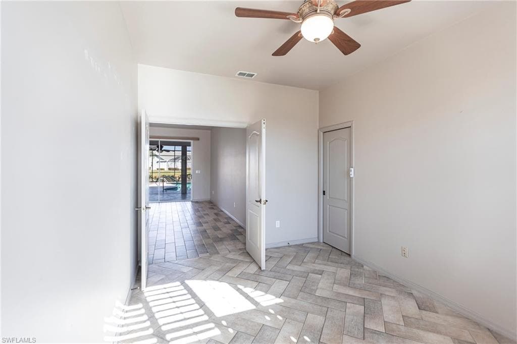 Featuring double doors and pocket door to primary bedroom and bathroom featuring Imported Italian Ceramic tiles.