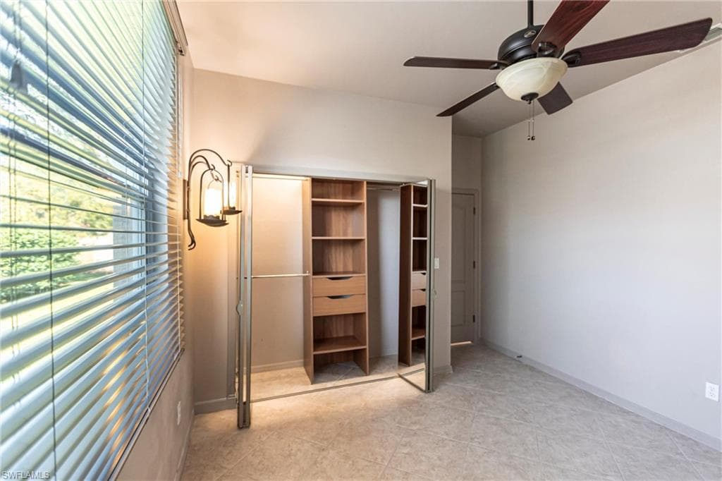 Hurricane rated window, lots of light, ceiling fan and built-in closet.