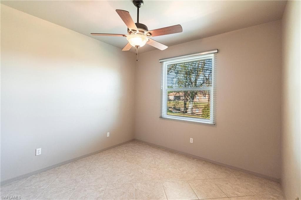 Custom tile, lighted ceiling fan in private guest wing.