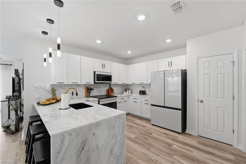 Luxurious kitchen upgrade with new Samsung Bespoke appliances, undermount sink, new lighting, pulls & more!