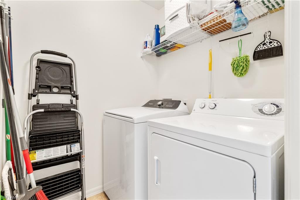 laundry located in hallway just off spare bedroom and bathroom