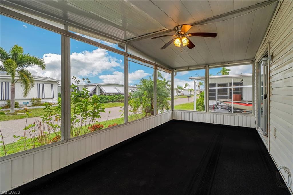 Screened-In Lanai with Ceiling Fan & Indoor/Outdoor Flooring
