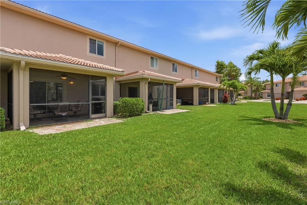 Expansive green lawn bordering residential structures