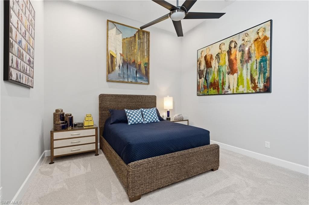 Spacious room featuring vaulted ceilings and light-toned carpeting