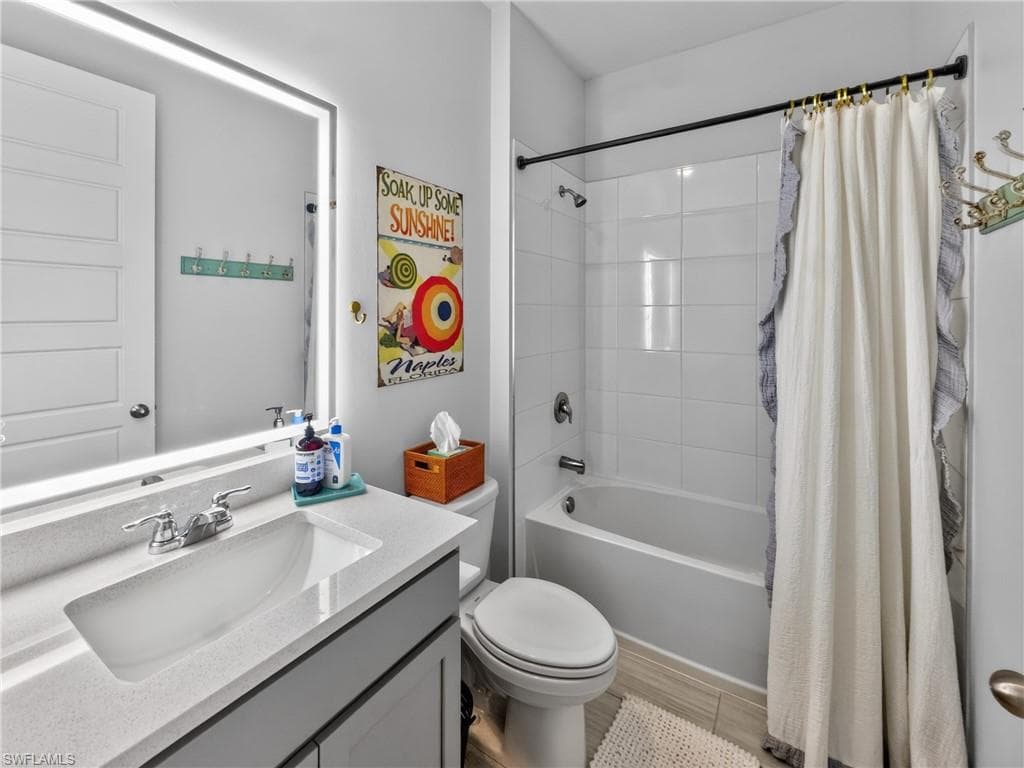 Full Bathroom off hallway with 2 additional spacious bedrooms