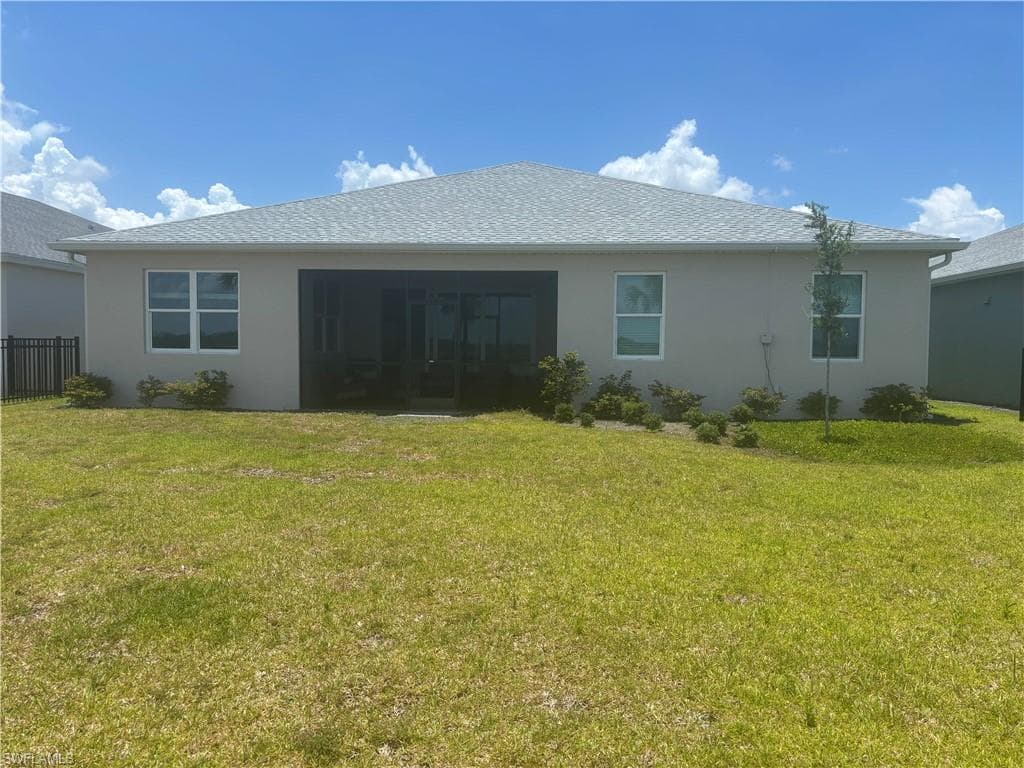 Rear view of home and enclosed lanai.