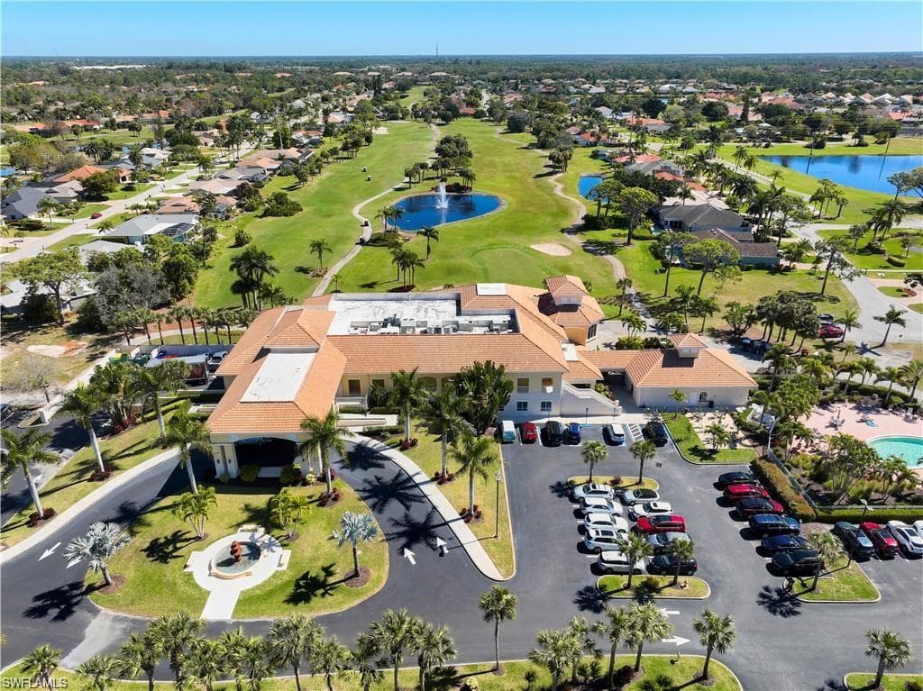 Birds eye view of property featuring a residential view and a water view