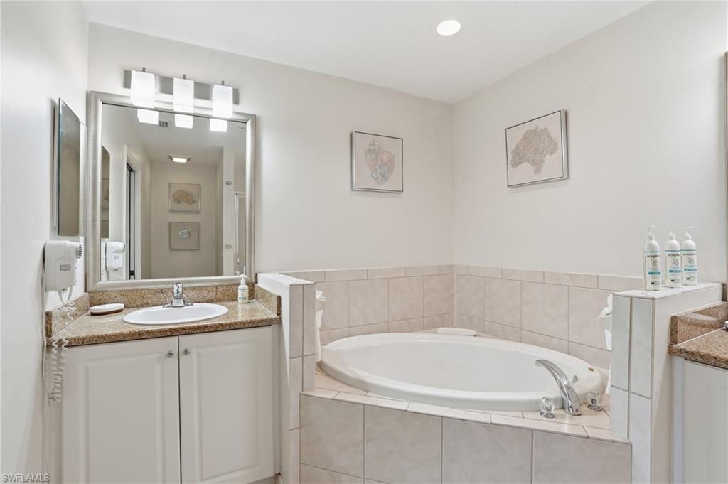 ENSUITE SPA BATH WITH SOAKING TUB AND DUAL SINKS..