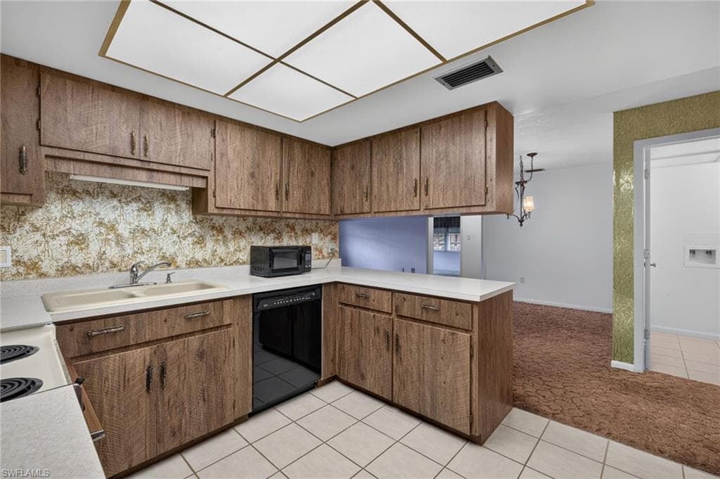 The Kitchen features Original Formica Countertops & Formica Barn Wood Custom Cabinetry
