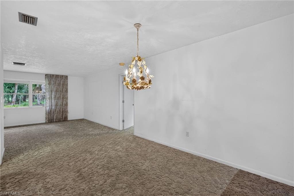 Actual Dining Area featuring a Charming Floral Chandelier