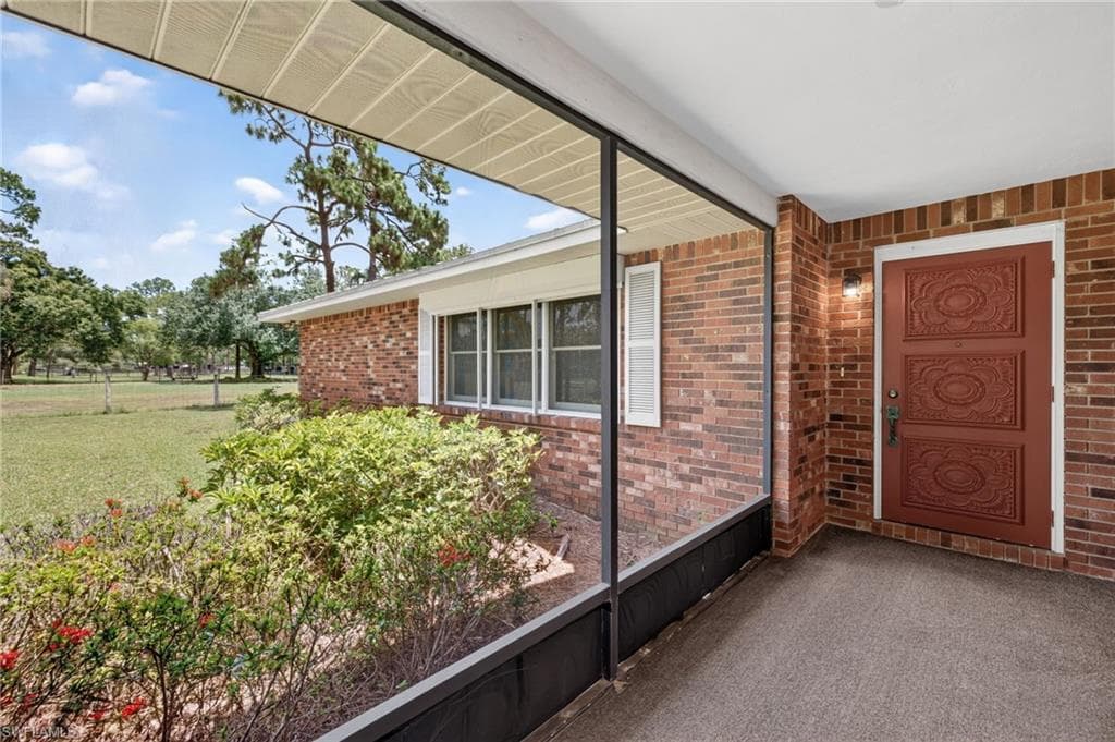 Screened-In Porch & Original Wood Door Entrance to Your New Home