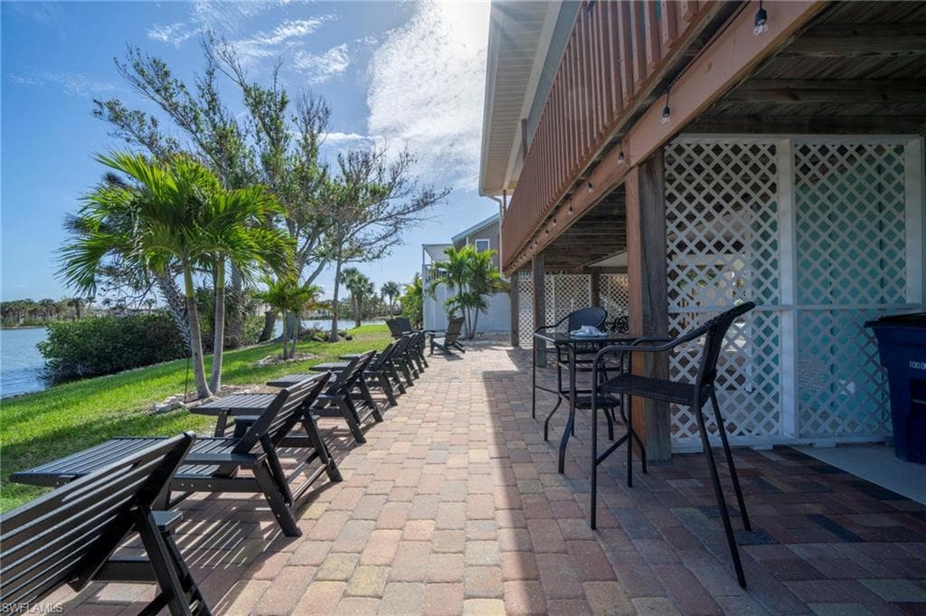 Lower-level sunning area with view of lake