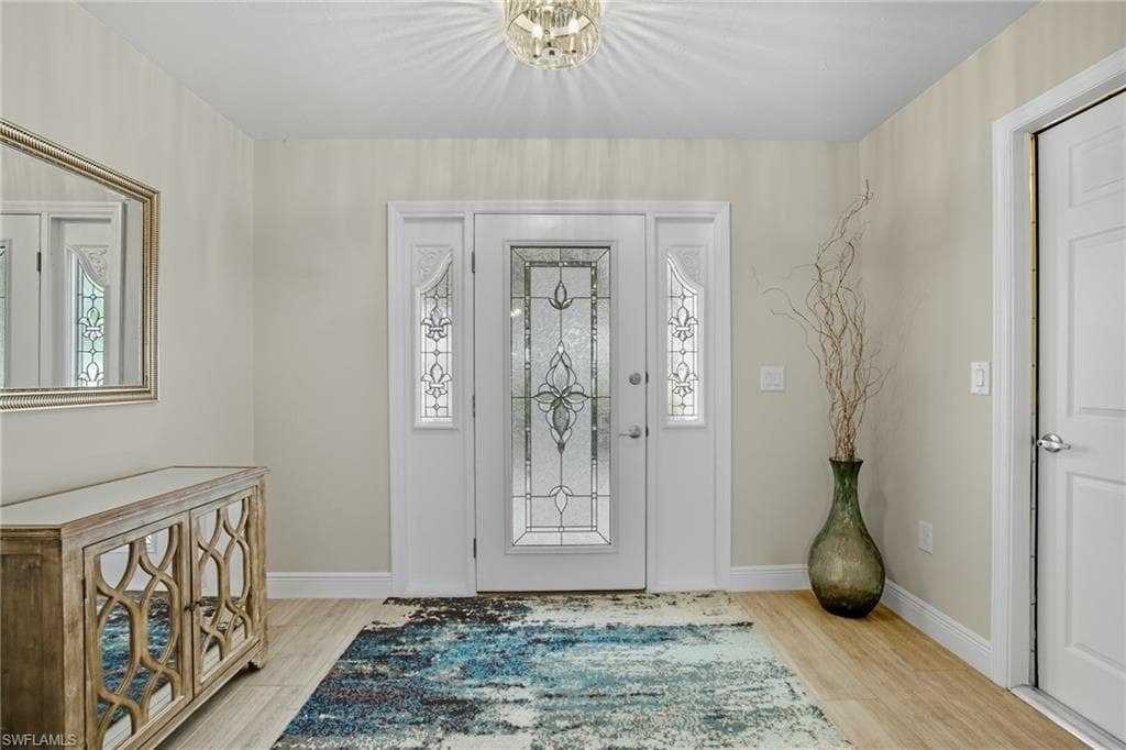 Front entry door with decorative glass inserts and matching sidelights