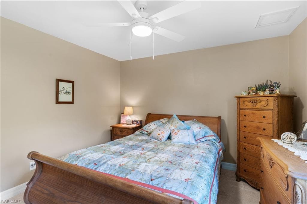 Room featuring neutral tone walls, white ceiling, and carpeted flooring