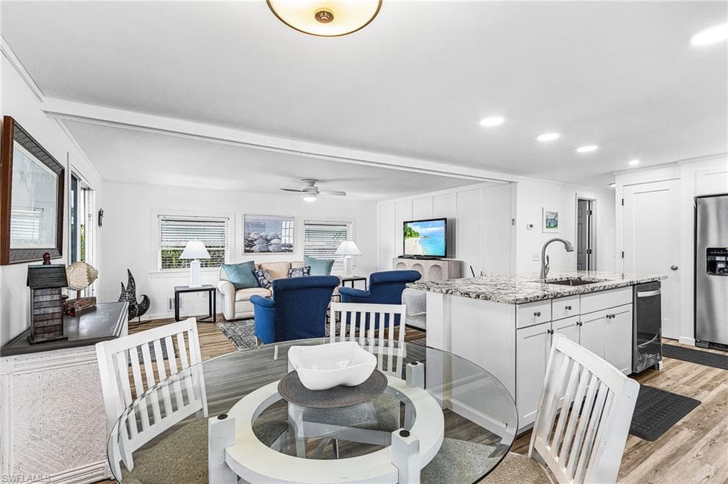 Open-concept living space featuring wood-finish flooring throughout