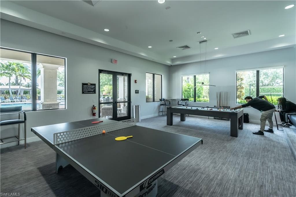 Recreational room featuring a ping-pong table and billiards table
