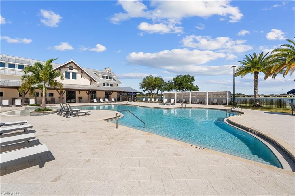 Expansive outdoor swimming pool with integrated spa