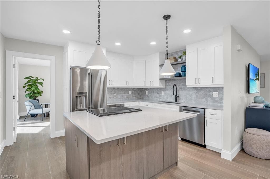 Wow! It feels like a model home with all the latest in kitchens. Large Island for hanging out and the latest upgrades in appliances and cabinetry