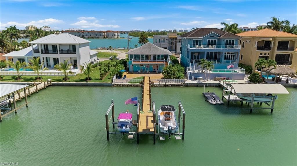 Featuring a dock with two boat lifts