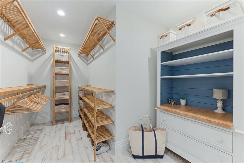 Primary walk in closet with ample storage