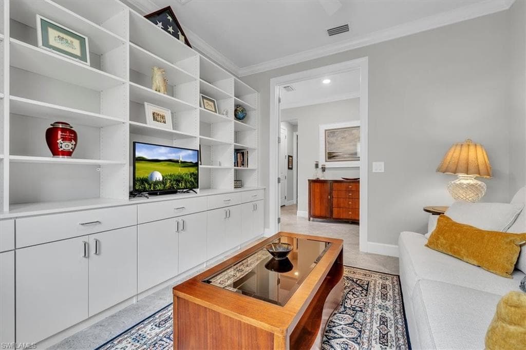 -featuring built in wall shelving and double doors