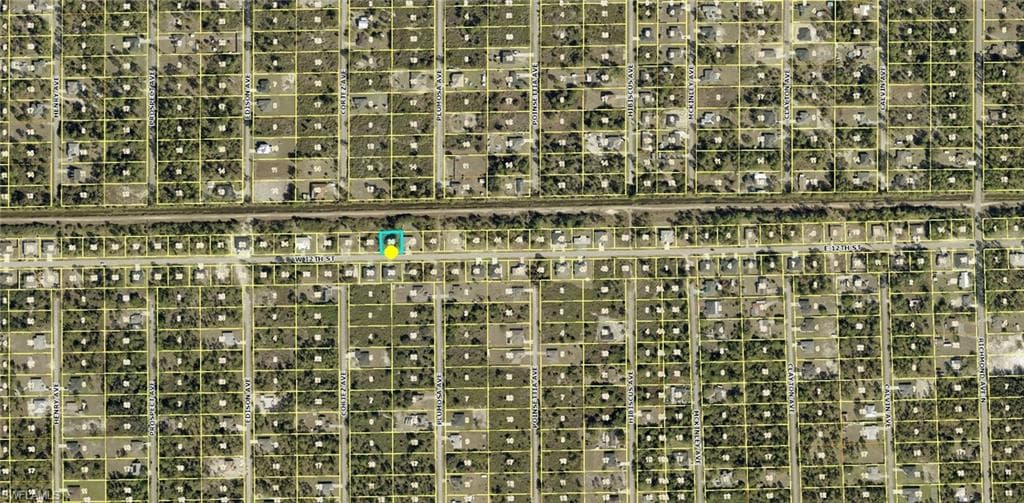 Aerial Map. Illustrating property parcels and a highlighted location within a developed area